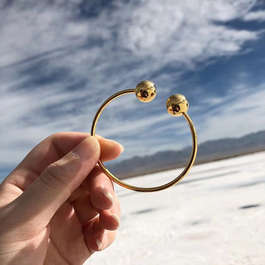 Two Globe Thin Gold Bracelet